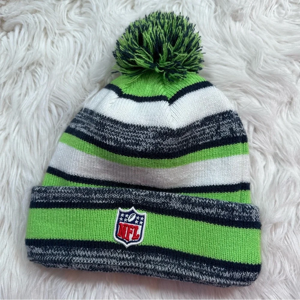 New Era • Official NFL Seattle Seahawks Striped Pom Pom Beanie - Picture 4 of 8